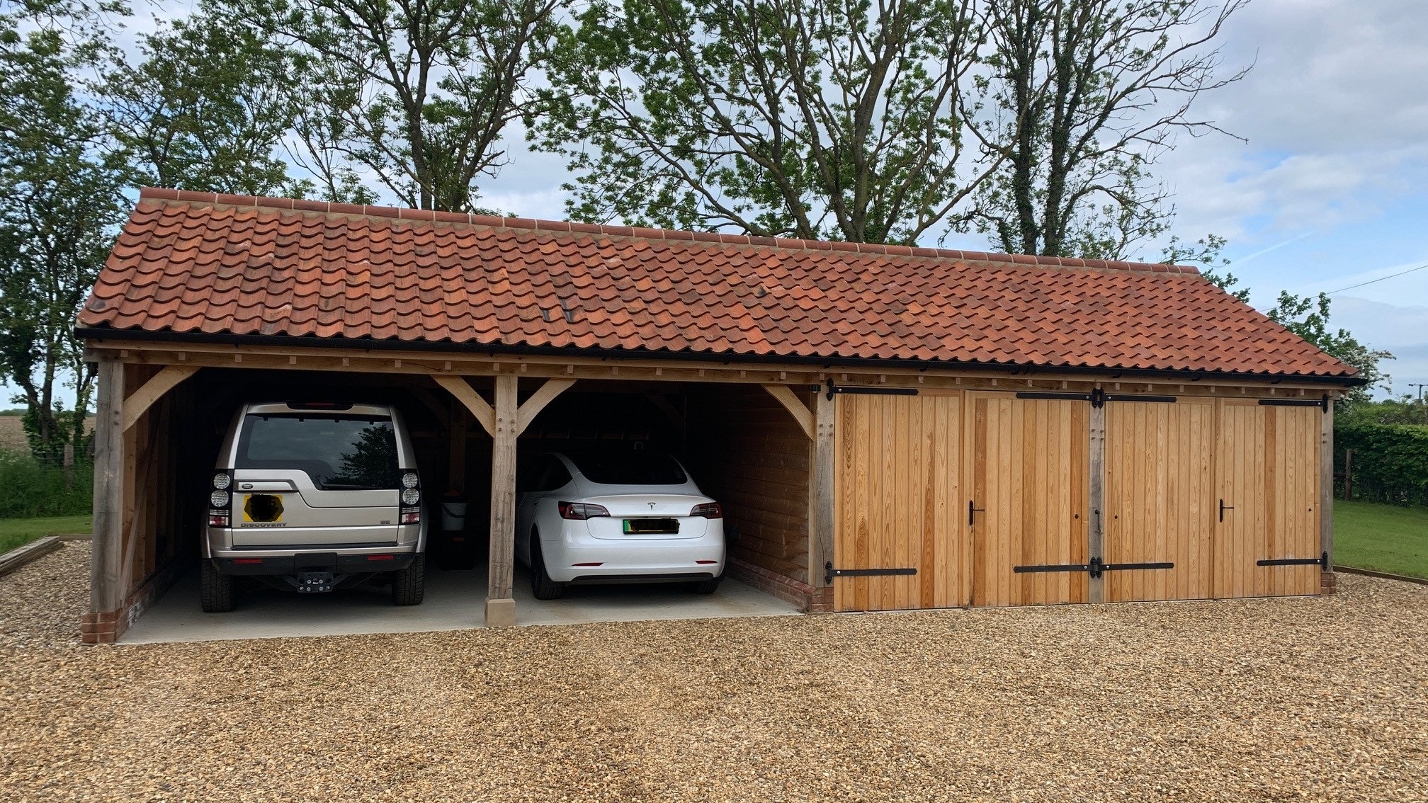 Oak framed garage with side log store in Essex