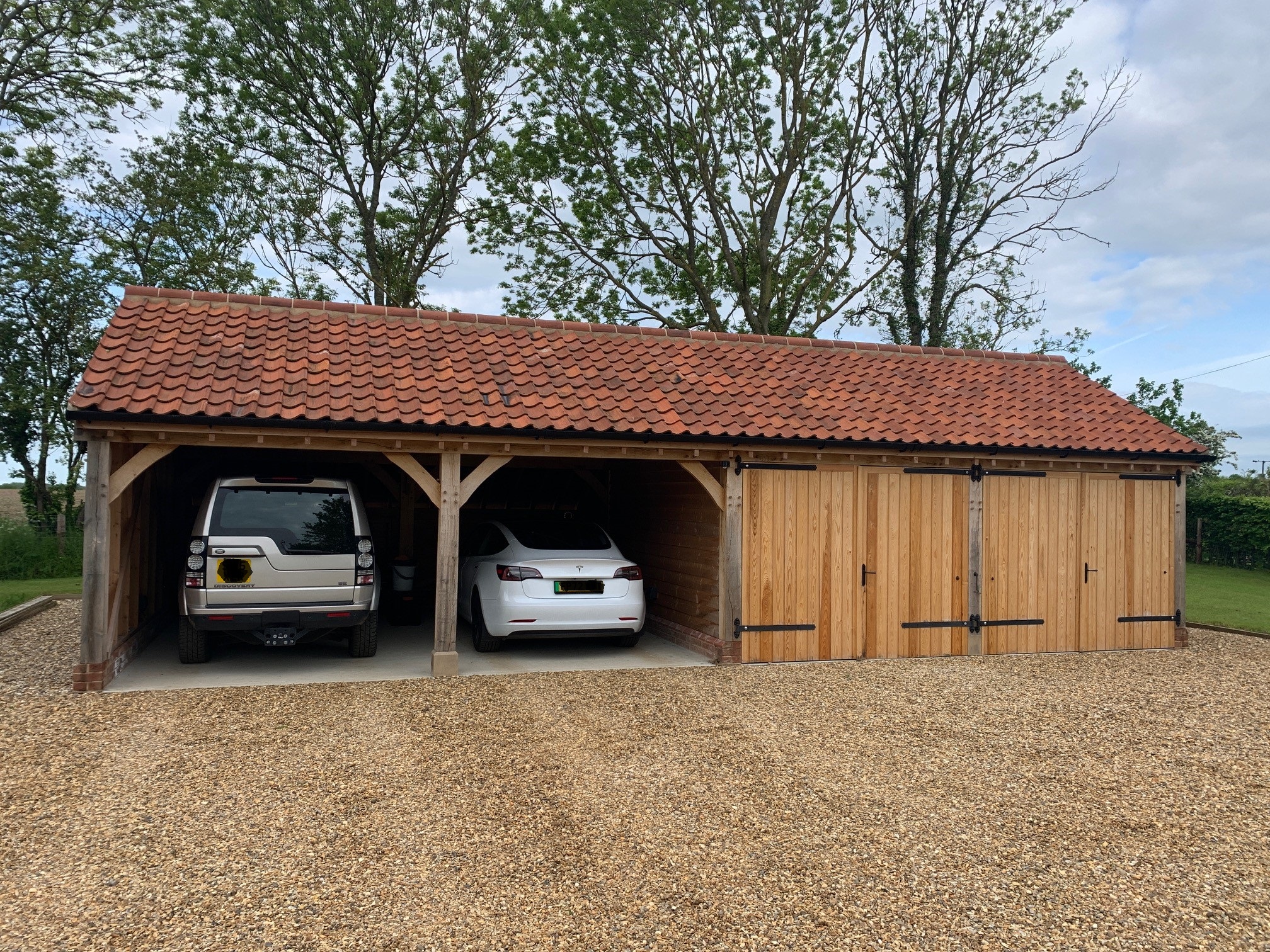 Oak framed garage with log store project in Essex by Southern Oak
